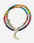 Colorful beaded necklace with a gold crescent moon pendant on a white background