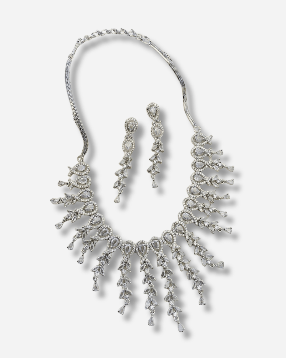 Silver plated American diamond statement necklace with cascading crystal details on display background