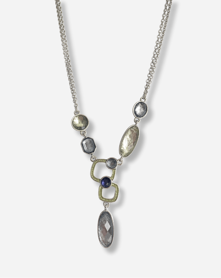 Necklace with variously shaped gemstones on a white background