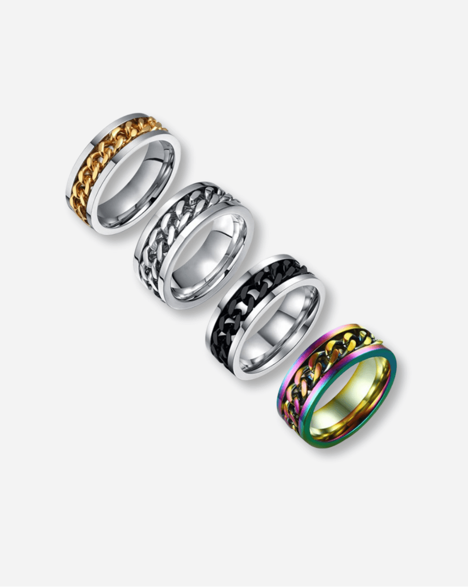Four metallic rings with different designs on a white background