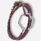 Bracelet with purple and gold braided design and silver hexagonal clasp on a white background