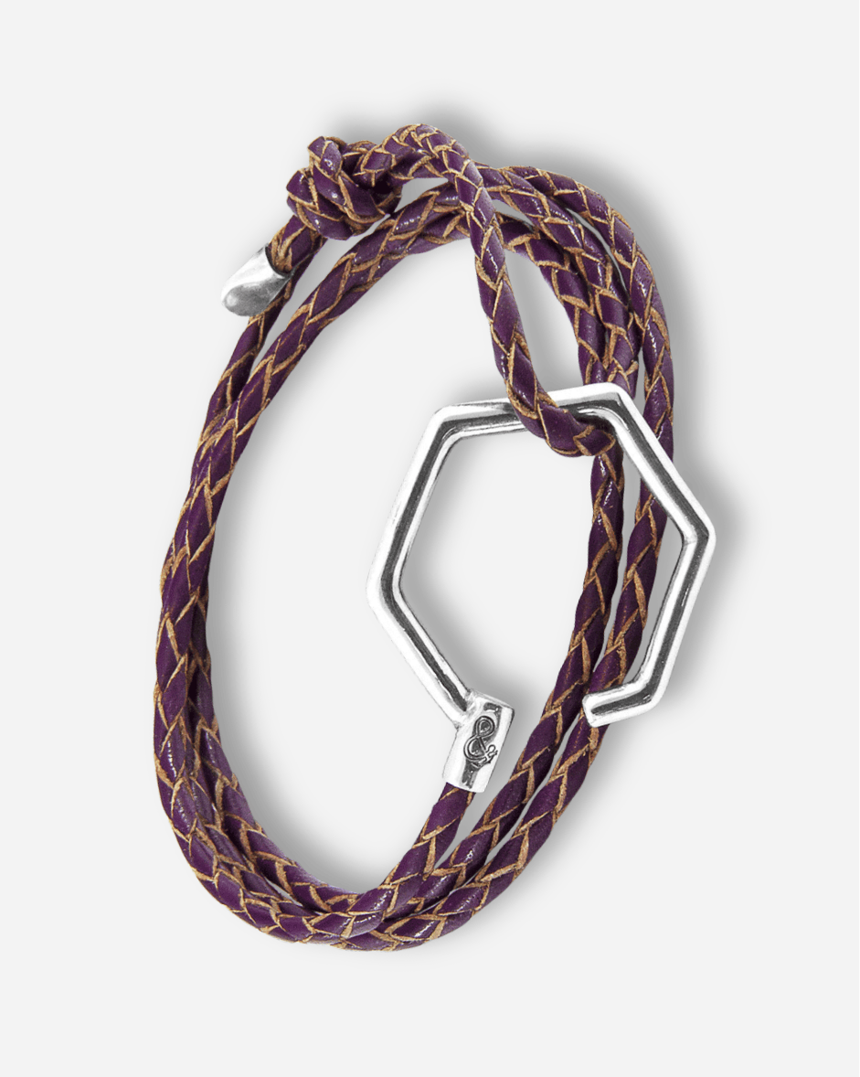 Bracelet with purple and gold braided design and silver hexagonal clasp on a white background