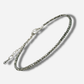 Silver bracelet on a light gray background