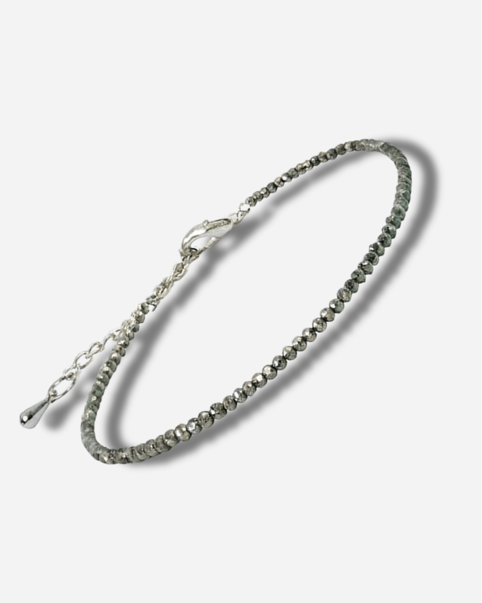 Silver bracelet on a light gray background