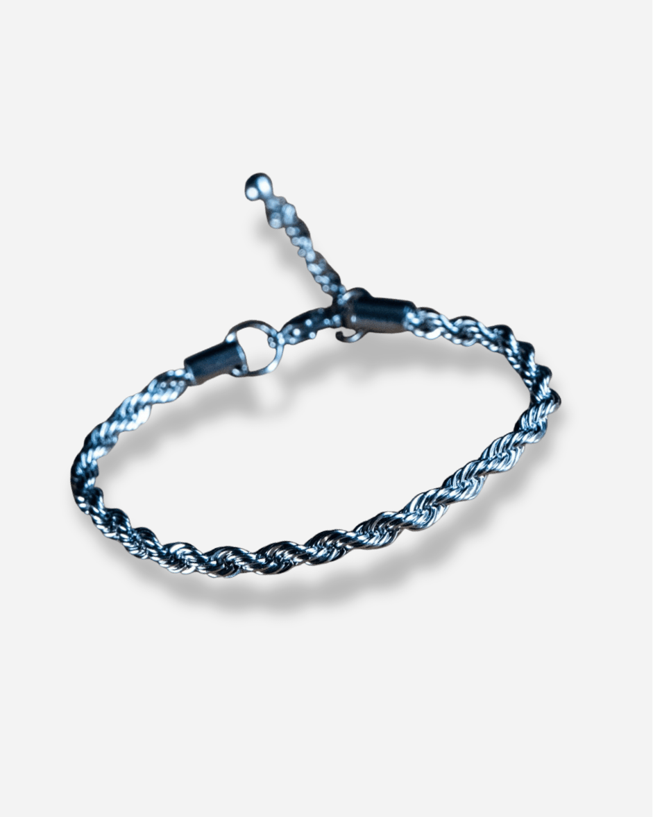 Blue braided bracelet on a light gray background