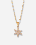 Gold necklace with a star-shaped pendant on a white background