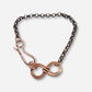 Bracelet with rose gold infinity symbol on a white background
