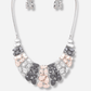 Necklace with pink and gray stones on a white background