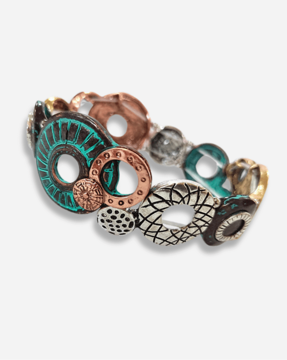 Set of colorful metal bracelets on a white background