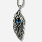 Silver feather-shaped pendant with a blue gemstone on a white background