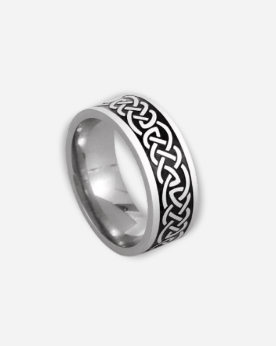 Silver ring with Celtic knot design on a white background