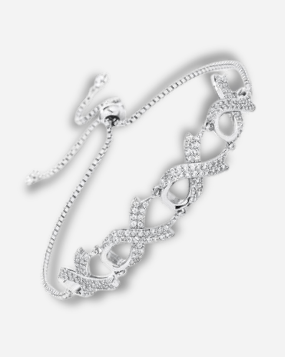 Silver bracelet with intricate design on a white background