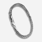 Silver braided bracelet on a white background