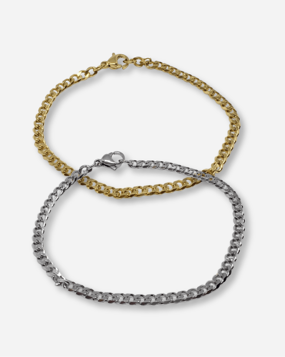 Two chain necklaces, one gold and one silver, on a white background.