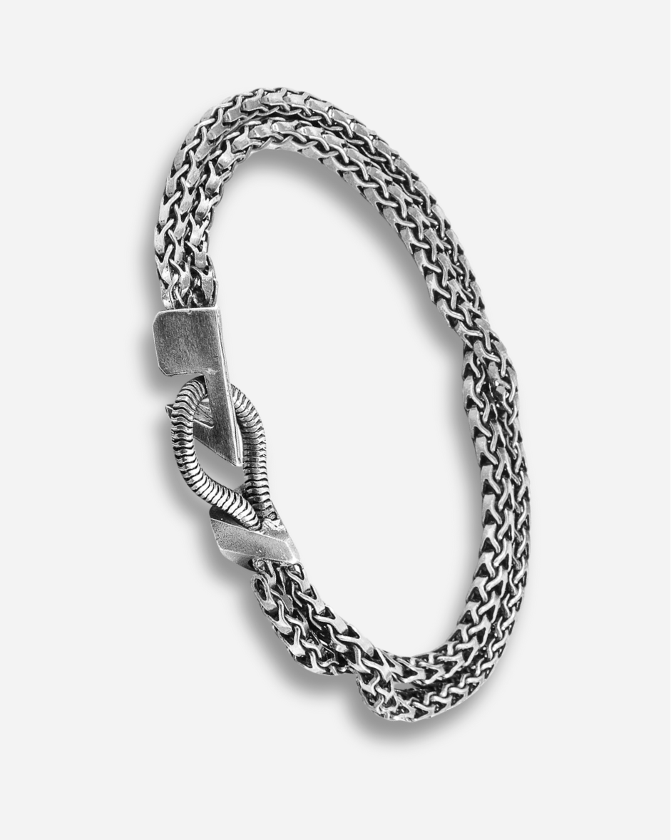 Silver chain bracelet on a white background