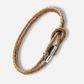Brown braided leather bracelet with a silver clasp on a white background