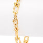 Gold chain bracelet on a white background