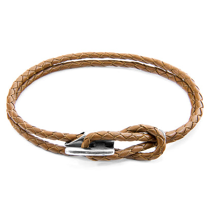 Brown braided leather bracelet with a silver clasp on a white background