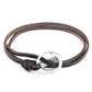 Brown leather bracelet with a silver clasp on a white background