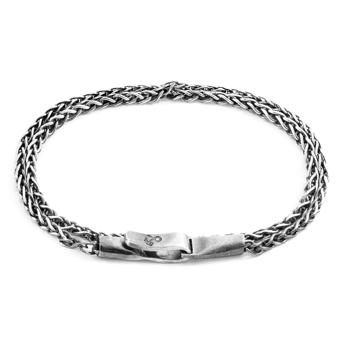 Silver braided bracelet on a white background