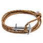 Brown braided leather bracelet with silver anchor clasp on a white background