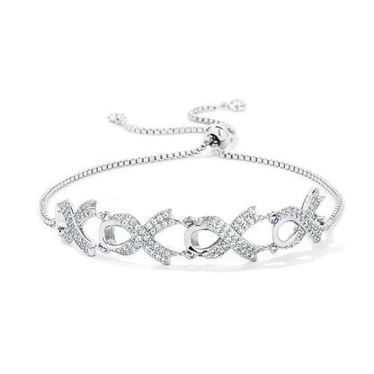 Silver bracelet with interlocking design on a white background