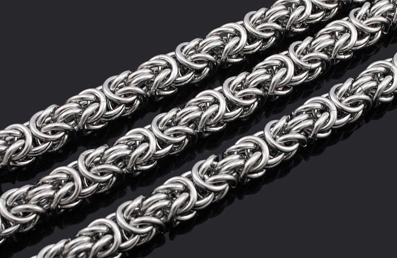 Silver chain necklace on a dark background
