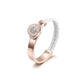 Rose gold ring with white braided band on a white background