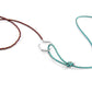 Two braided necklaces, one brown and one turquoise, on a white background.