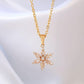 Gold necklace with a snowflake pendant on a white background