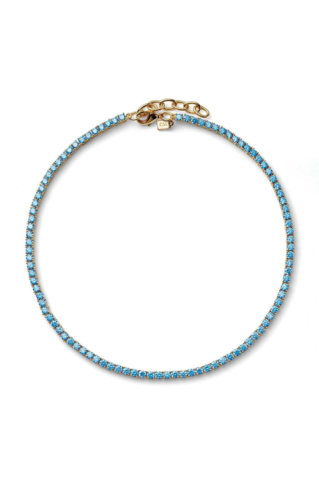 Blue beaded bracelet with gold clasp on a white background