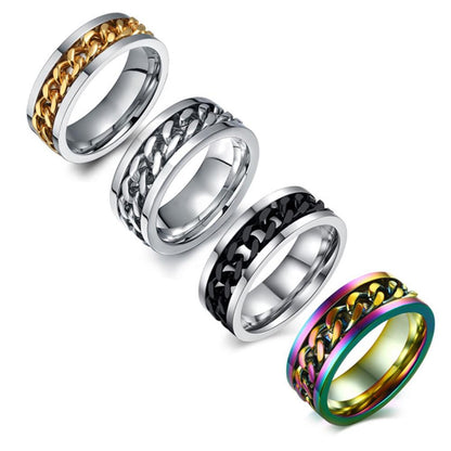 Four metallic rings with chain designs on a white background